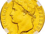 a close up of a gold coin with a woman ' s head on it