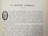 an open book with a picture of a landscape in it