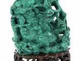 an image of a green vase sitting on top of a wooden stand