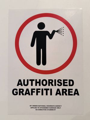 a sign that says authorized graffiti area on the wall