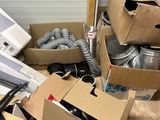 a pile of boxes and other items in a room