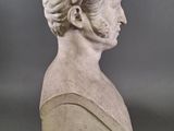 an image of a bust of a woman on a gray background