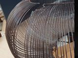 a fan that is sitting on a table in a room