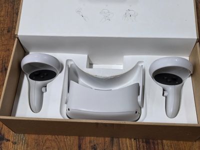 a box with two cups and a cup holder inside of it
