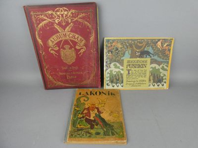 three books sitting on a table next to each other on a table
