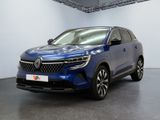 a blue car is parked in a white room with a black floor