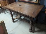 a wooden table with a mirror on top of it