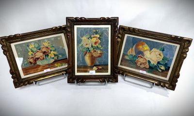 three framed pictures of flowers in a vase on a table
