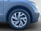 a close up view of the front wheel of a car