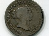 une vieille pièce d'argent portant une tête de femme