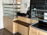 a counter that has a glass case in it