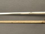 an image of a sword and a dagger on a table