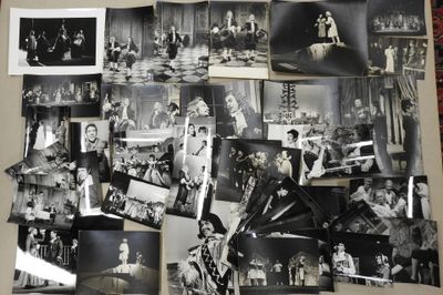 several black and white photographs of people and their families on a table