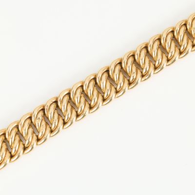 a close up of a gold chain on a white background