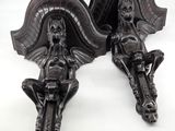 pair of antique cast iron wall sconces of a woman and child