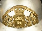 a white helmet with a gold crown on top of it