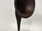 a black and brown gramphone on a white table