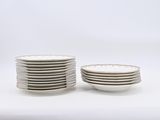 many plates stacked on top of each other on a table