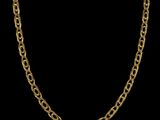 a gold chain necklace with an oval link on a black background