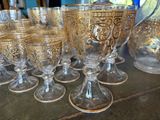 a lot of glasses that are sitting on a table