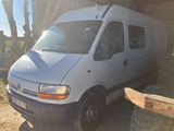 a white van that is parked in front of a building