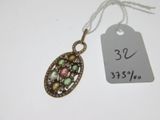 an image of a necklace with a tag attached to it