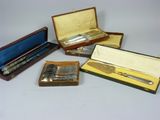 several different types of silverware in a wooden case