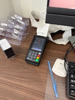 a cell phone sitting on a desk next to a keyboard