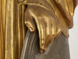 an image of a statue of a woman holding a book