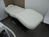 an image of a white massage table in a room