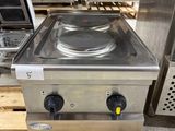 an image of a stove top sitting on top of a wooden pallet