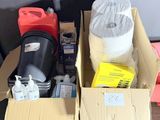 a box of items sitting on the floor next to a trash can