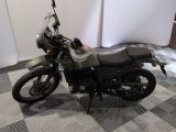 a motorcycle that is sitting on a checkered floor