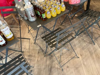 many bottles of liquor on a table in a store