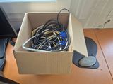 a cardboard box full of wires and wires on the floor