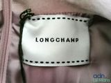 longchampp label on the back of a pink jacket