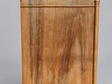 an old wooden cabinet with a door and a drawer on the bottom
