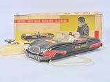 a toy car that is sitting on a table next to a box