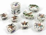 several pieces of porcelain are arranged in a circle on a white surface