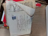 a box full of books and papers sitting on the floor