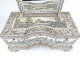 a silver box with a mirror on top of it