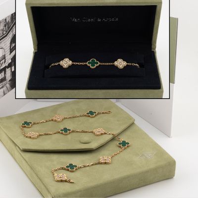 an image of a box containing a necklace, bracelet, and ring