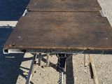 a table that is sitting in the middle of a parking lot