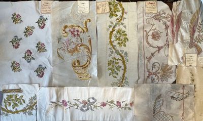 a lot of different types of embroidery on the table