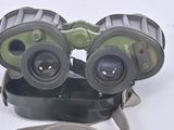 a pair of binoculars sitting on top of a black case