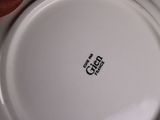 a white plate with a black and white design on it