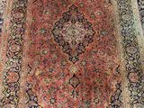 an oriental rug with a medallion design on a black ground