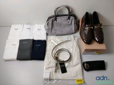 a bag, a purse, a pair of shoes, a belt, and a pair of shoes on a table