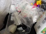 a pile of toilet paper, toilet paper, and other items in a trash can