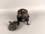 a small metal object that is sitting on the ground